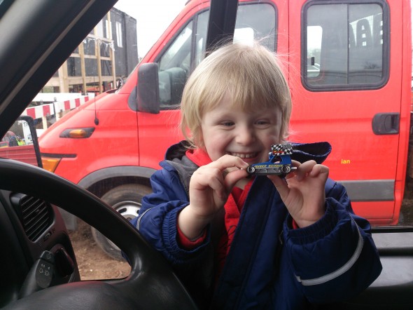 Dylan Hucker, aged 3, with his toy FWJ car. He loves playing with it, even though he was supposed to be watching his Daddy race at Grimley!