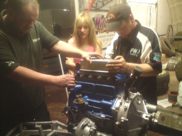 James, Phoebe, and Wez in the middle of the engine change. James, Phoebe, and Wez in the middle of the engine change.